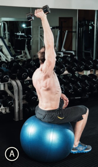 Man performing the gym ball one-arm overhead triceps extension - how to build bigger arm muscles