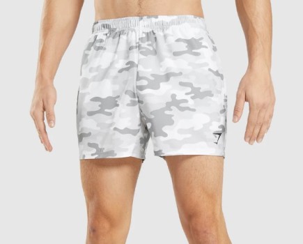 A man wearing Gymshark Arrival 5-inch shorts