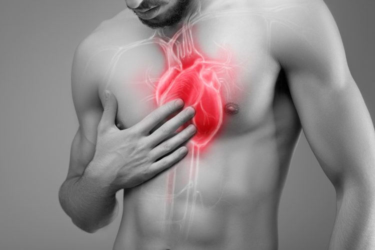 A man holding his hand to his chest with an image of his heart beneath it