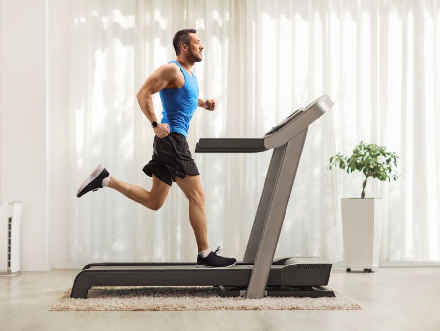 man using treadmill at home