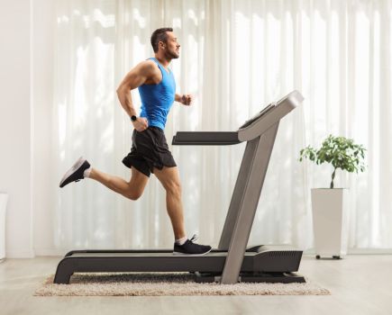 man using treadmill at home