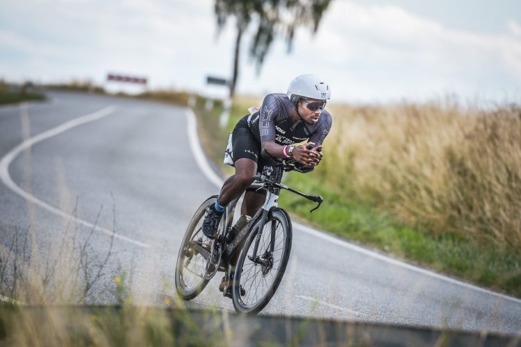 Sam Holness riding a time trial bike