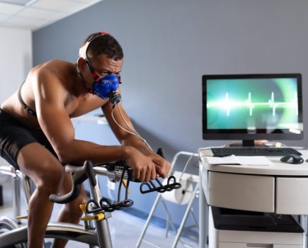 Man riding exercise bike undergoing metabolic testing