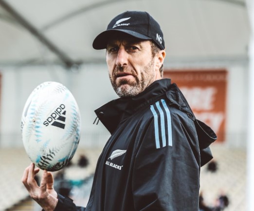 All Blacks strength and conditioning coach Nic Gill balances a rugby ball on his finger