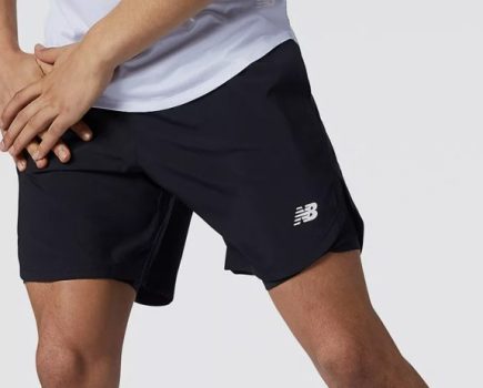 A man's lower body wearing the New Balance Fast Flight 2 in 1 7-Inch Shorts