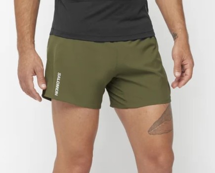A man wearing Salomon Cross 5-inch shorts