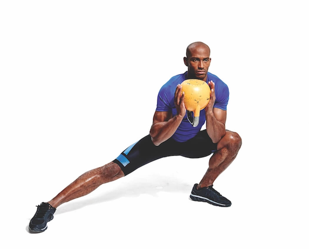 man performing kettlebell side lunge