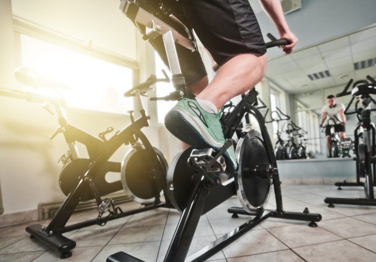 Man in a fitness studio on an exercise bike