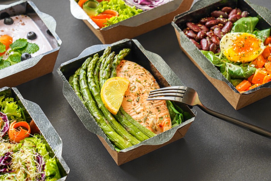 Healthy, high-protein meals lined up on a table