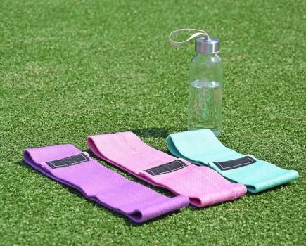 Fabric resistance bands laid out on the grass