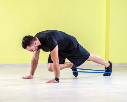 Man demonstrating the benefits of mini resistance bands