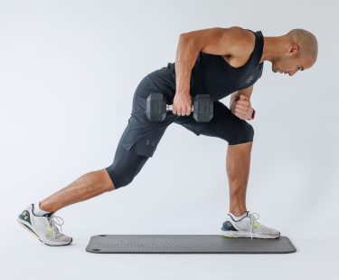 Man performing end of single arm row