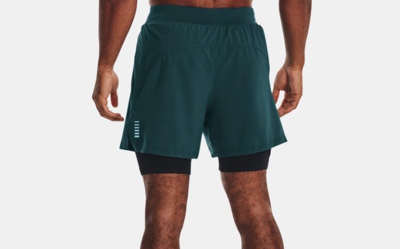 A man's lower body wearing Under Armour Iso-Chill Run 2-in-1 Shorts