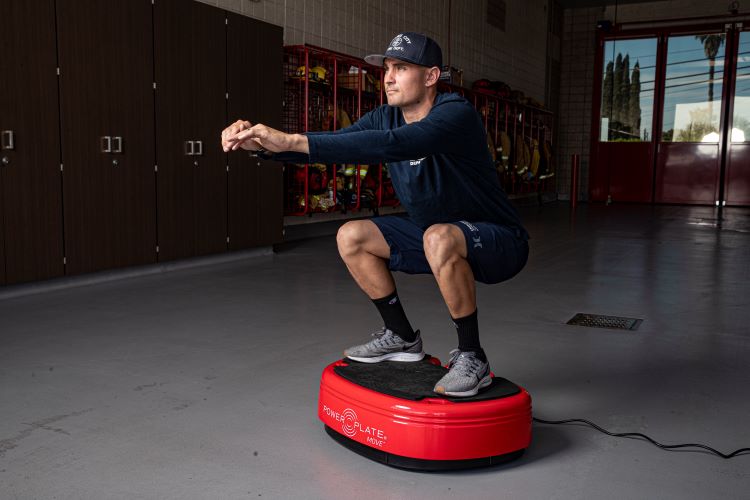 Man exercising on a vibration plate