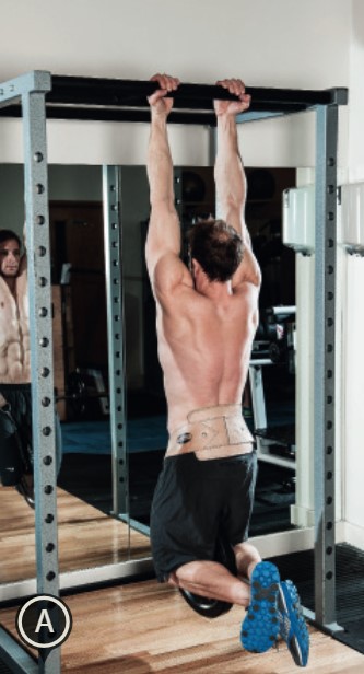 Man performing the weighted chin-up - how to build bigger arm muscles