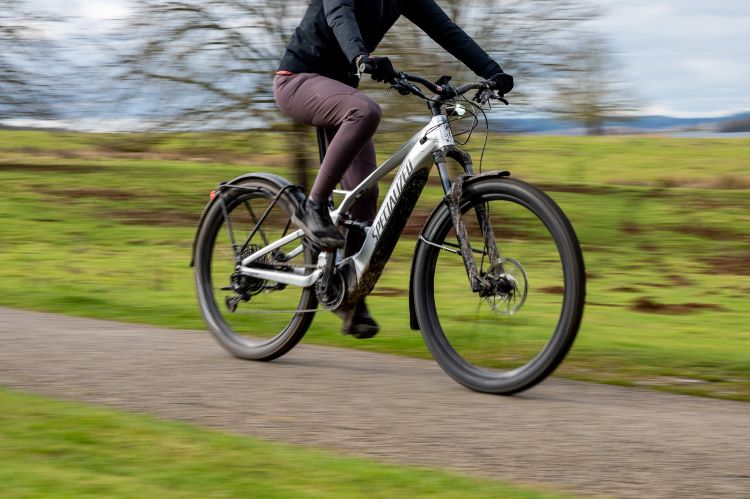 An e-bike being ridden through the countryside